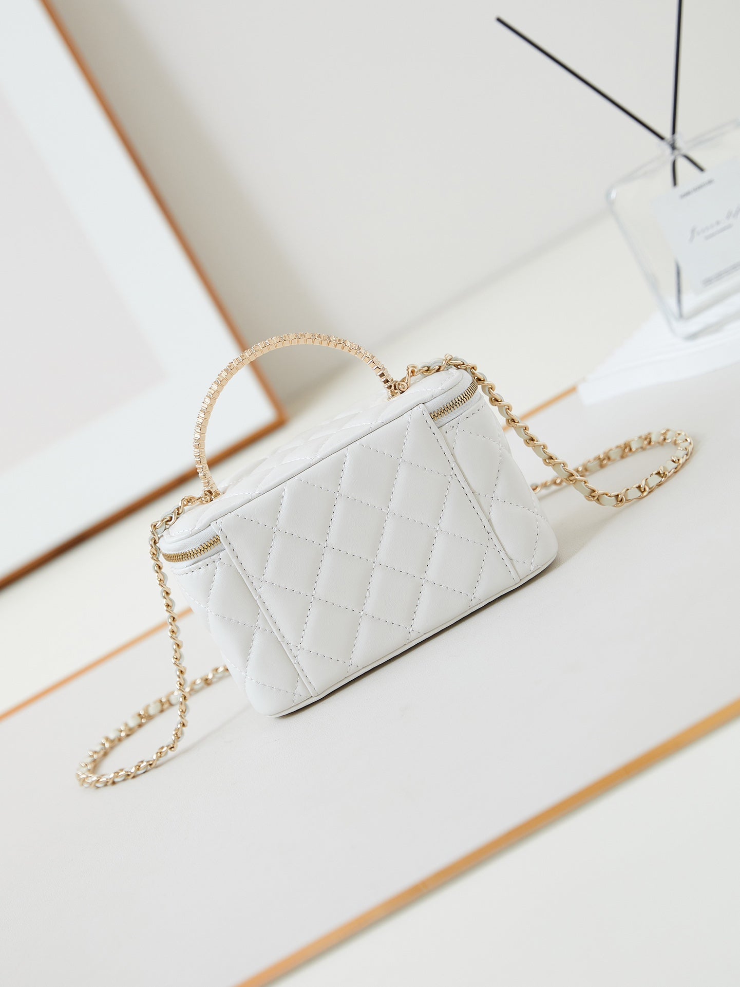 CHANEL 25S MINI VANITY BAG 16 CM IN WHITE LAMBSKIN WITH CRYSTAL-EMBELLISHED  LOGO