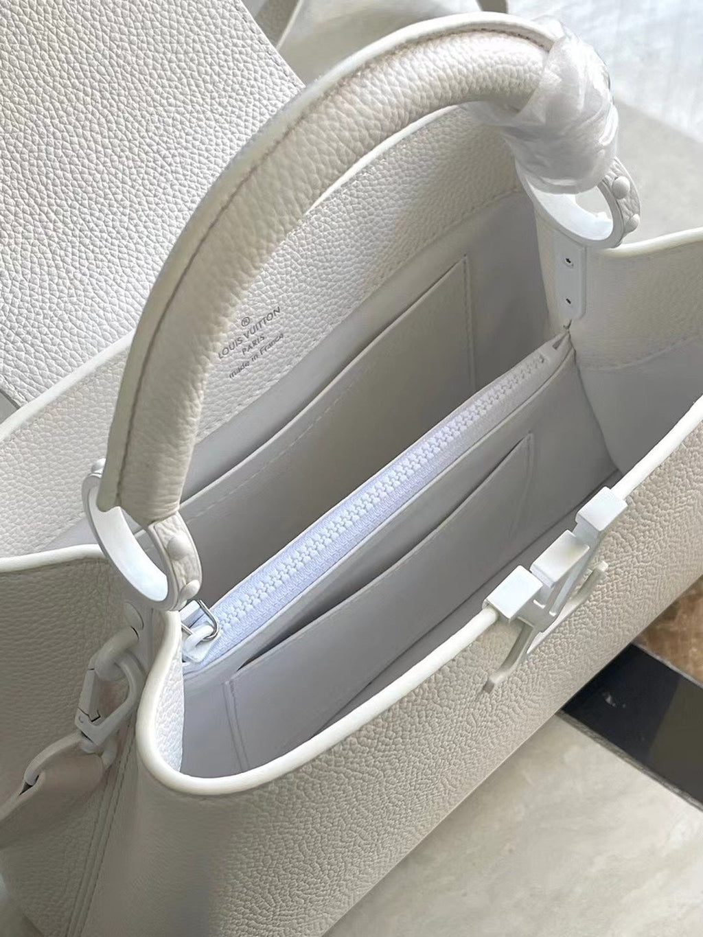 LOUIS VUITTON CAPUCINES EAST-WEST BB 27 IN WHITE TAURILLON