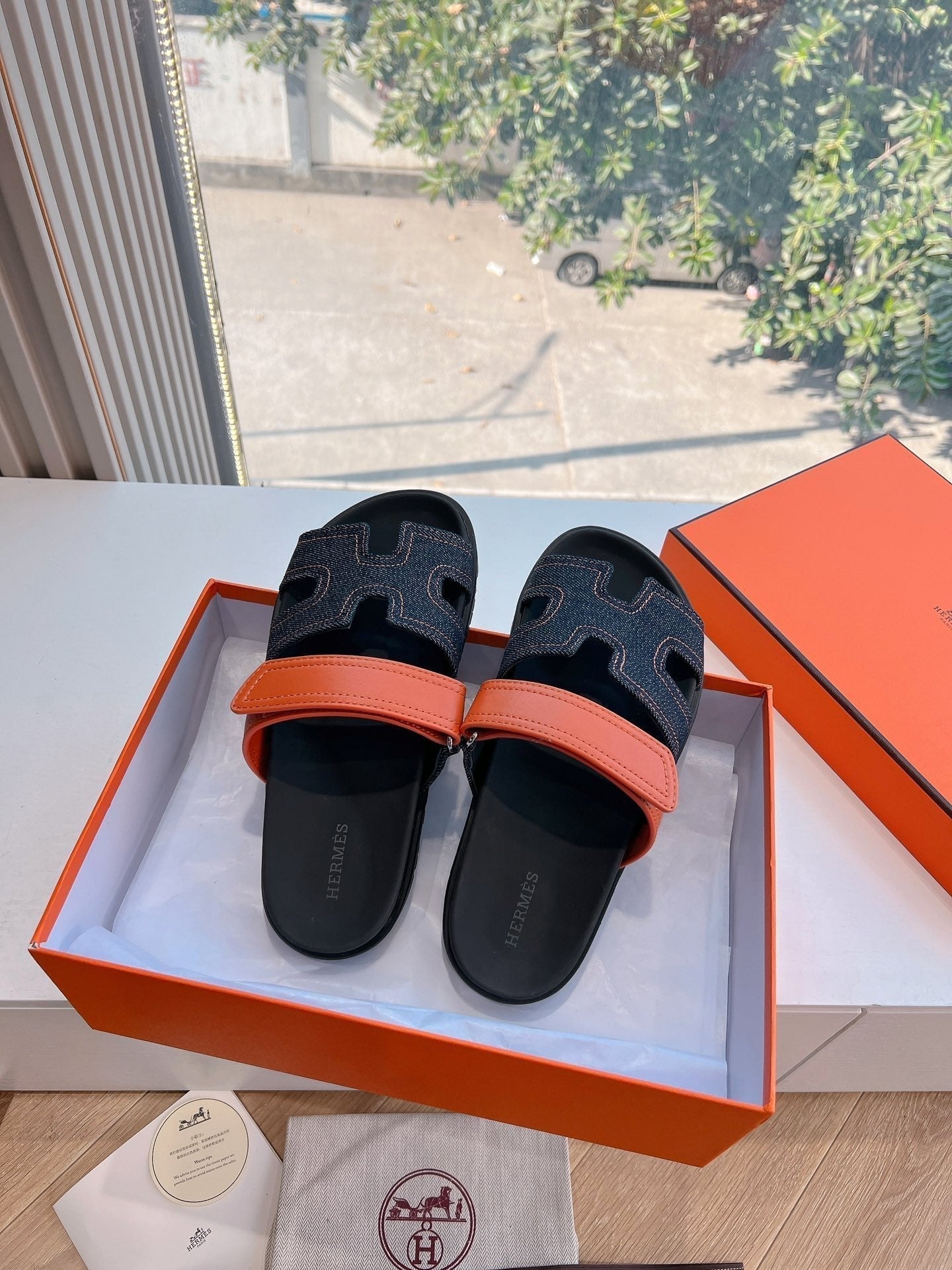 HERMES CHYPRE SANDAL IN BLACK DENIM AND VIVID ORANGE CALFSKIN